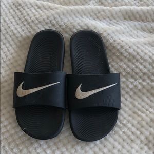 black Nike slides